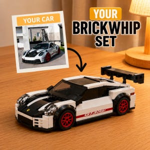 May include: A white and black brick-built model sports car with red wheels and a large rear spoiler. The text YOUR BRICKWHIP SET is displayed above the model, and a photo labeled YOUR CAR shows a full-sized white sports car with red wheels.