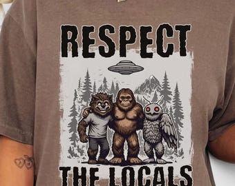 Funny Cryptid Graphic Tee, Bigfoot Mothman Werewolf UFO Shirt, Supernatural Gift for Creature Lovers, Respect the Locals Weirdcore T-Shirt