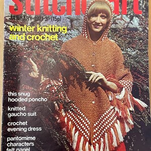 May include: A vintage magazine cover for Stitchcraft, featuring a woman wearing a knitted hooded poncho with a white and orange fringe. The cover text reads "JANUARY 1971 3/-(15p) winter knitting and crochet this snug hooded poncho knitted gaucho suit crochet evening dress pantomime characters felt panel No 445 Australia 40 cents Canada & U.S.A. 60 cents South Africa 30 cents New Zealand 30 cents".