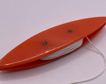 Orange tatting shuttle, vintage