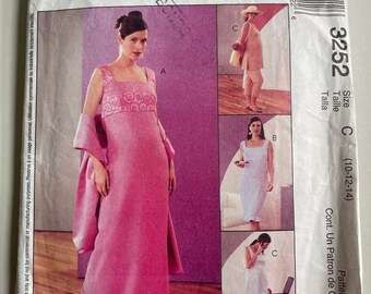 May include: McCall's sewing pattern envelope for a dress, sizes 10-12-14. The envelope shows three different views of the dress, one in pink, one in white, and one in a light blue color. The pattern number is 3252.