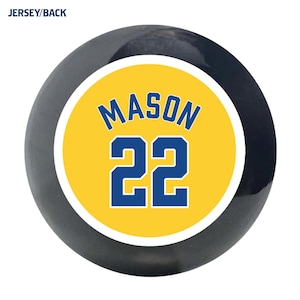 May include: A black and yellow circle with the name "MASON" and the number "22" in blue.