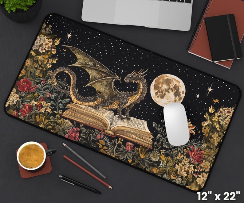 May include: A black dragon with wings outstretched sits on top of an open book with a full moon in the background. The book is surrounded by a floral design with a dark blue background and white stars. The mouse mat is 30.5 cm by 55.9 cm.