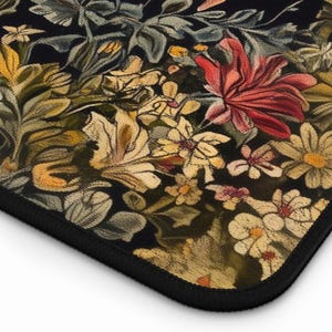May include: A black background with a floral pattern in shades of yellow, red, and green. The flowers are stylised and have a vintage look.
