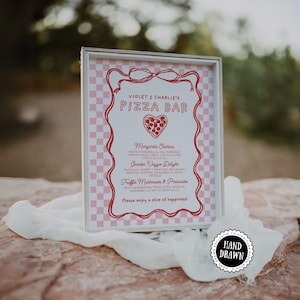 May include: A framed sign with a pink and white chequered background and red decorative border. The sign reads "Violet & Charlie's Pizza Bar" and lists pizza toppings. A "Hand Drawn" sticker is in the corner.