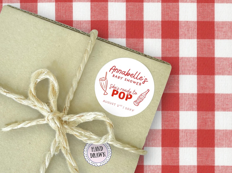 She’s Ready to Pop Baby Shower Soda Bar Style round Canva sticker template – 50s Soda Pop-Inspired. This Baby Shower sticker Template is easy to edit and print at home. It features red retro style fonts with a hand-drawn 1950s style soda bottle illustration on a white background- perfectly matching with the rest of this suite. Use for Invitation envelopes, on party paper cups, as labels for party favors and many other uses. Drag & drop templates included to easily print at home