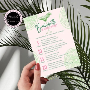 May include: A pink and green bachelorette party scavenger hunt card featuring a margarita glass illustration. The card lists a series of challenges for the bride-to-be to complete, with points awarded for each task. The card includes the text "Bachelorette Scavenger Hunt" and "Use your phone to take a photo as proof".