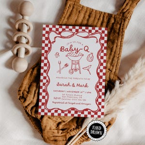 May include: A rectangular invitation card with a red and white chequered border featuring red line art of a grill, pacifier, bib, and utensils. The text reads: Join us for a Baby-Q, honouring the parents-to-be, Sarah & Mark, Saturday, November 10th, 2pm.