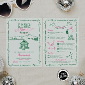 May include: A two-page invitation with a cabin theme, featuring green and pink text and illustrations. The left page says "Cabin Crew Before I Do" and lists the bride's name, date, and RSVP information. The right page details the weekend's events.