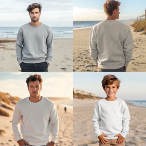 May include: Four people wearing white and gray sweatshirts on a beach. The sweatshirts are long-sleeved and have a crew neck.