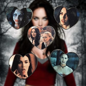May include: A composite image featuring a woman with dark hair, surrounded by five heart-shaped images. Each heart contains a different image of the same woman, with varying expressions and scenes. The background is a blurred, dark forest.