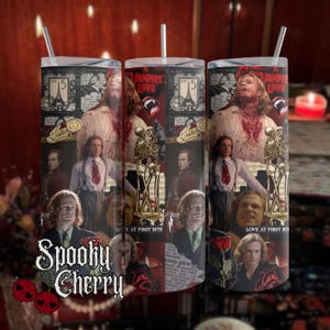 May include: Three tall, stainless steel tumblers with black lids and straws. Each tumbler features a collage of images with a vampire theme, including the text "VAMPIRE LOVE" and "LOVE AT FIRST BITE". The "Spooky Cherry" logo is also visible.
