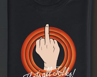 May include: Black t-shirt featuring a cartoon hand giving the middle finger inside a red and orange circle. The text "That's all Folks!" is written in white script below the graphic. The shirt is folded.