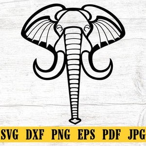 May include: Black and white line art illustration of an elephant's head with large ears and tusks.