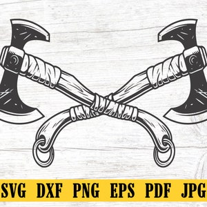 May include: Two black and white axe heads with wooden handles are crossed over each other. The handles are wrapped with a rope-like material.