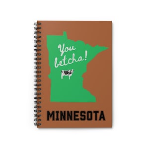 May include: Spiral-bound notebook with a brown cover featuring a green outline of Minnesota. The words "You betcha!" are written in cursive, with a cow graphic. The word "MINNESOTA" is in bold, black letters.