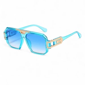 May include: Blue sunglasses with a gradient blue lens and a light blue frame. The sunglasses have gold-colored accents on the temples and the bridge. The lenses are a square shape.