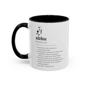 May include: White ceramic mug with a black handle and interior. The mug features the Arabic word "abbu" and its English translation, along with a definition. A perfect gift for a loved one.