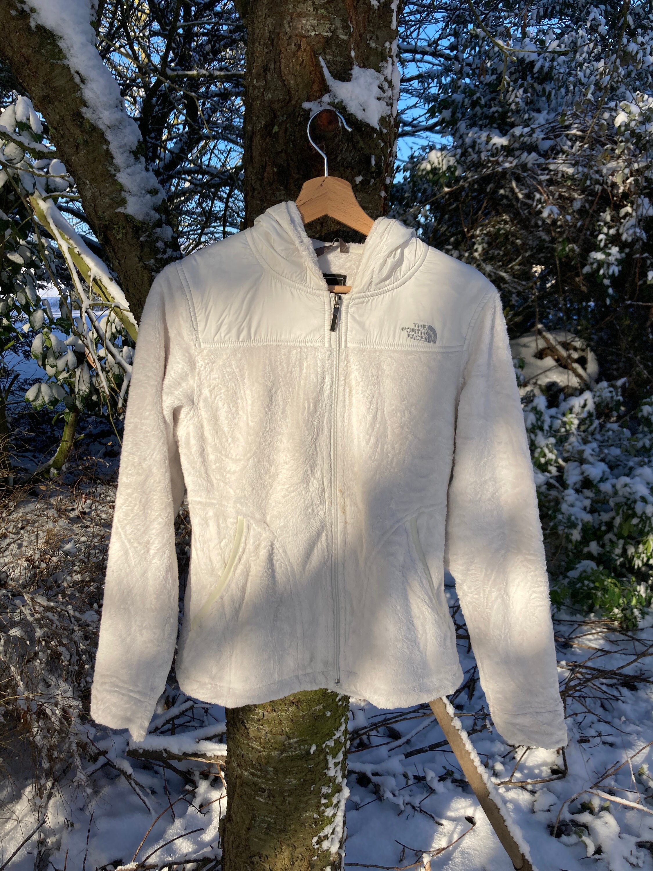 White fuzzy top north face jacket