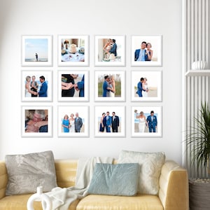May include: A white wall with a collage of 12 framed wedding photos. The photos are arranged in a grid pattern and feature the bride and groom in various poses. The photos are all in color and are printed on white paper. The frames are all white and have a simple design.