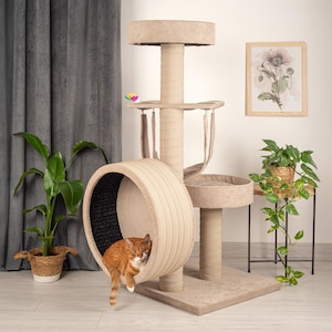 May include: Beige cat tree with a round tunnel, a scratching post, and multiple platforms. A ginger cat is sitting in the tunnel.