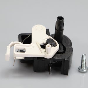 May include: A black plastic mechanical component featuring a white plastic lever arm with a small circular pivot point and a thin metal wire, accompanied by a single silver-colored metal screw with a threaded shaft and a rounded head.