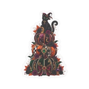 May include: A sticker featuring a black cat wearing a witch hat perched atop a stack of three decorated pumpkins. The pumpkins are adorned with jewels, pearls, ribbons, black roses, and autumn leaves, creating a detailed, ornate seasonal display.