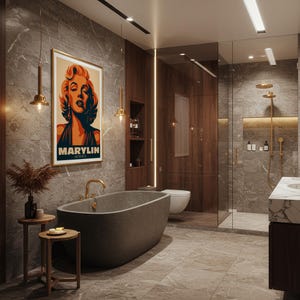 May include: A modern bathroom with a gray stone bathtub, a Marilyn Monroe poster, and a glass shower. The walls are covered in gray marble-like tiles. Two small wooden side tables with decorative items are next to the bathtub.