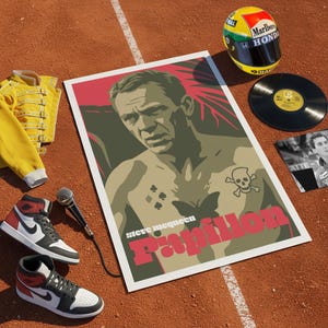 May include: A collection of items including a poster with a man's portrait, a yellow jacket, trainers, a microphone, a vinyl record, and a racing helmet. The poster features the word "Papillon" in red.