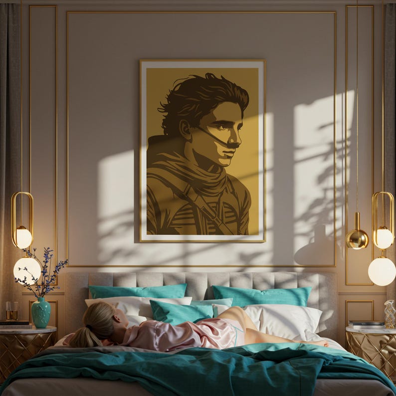 May include: A bedroom scene featuring a framed art print of a person with a breathing apparatus. The artwork is in shades of brown and gold, mounted above a bed with teal and white pillows and a teal blanket. Decorative lighting and a person lying on the bed complete the scene.