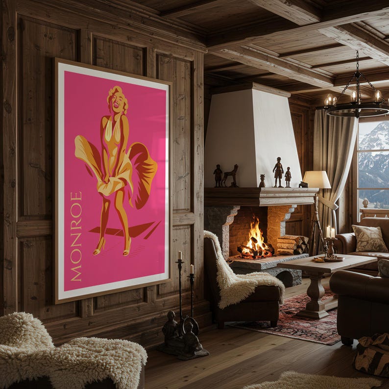 Puede incluir: Un p&oacute;ster enmarcado con una ilustraci&oacute;n estilizada de Marilyn Monroe con un vestido rosa, con el nombre "MONROE" impreso verticalmente. La obra de arte est&aacute; sobre un fondo rosa y enmarcada en un marco de madera, exhibida en un sal&oacute;n r&uacute;stico.