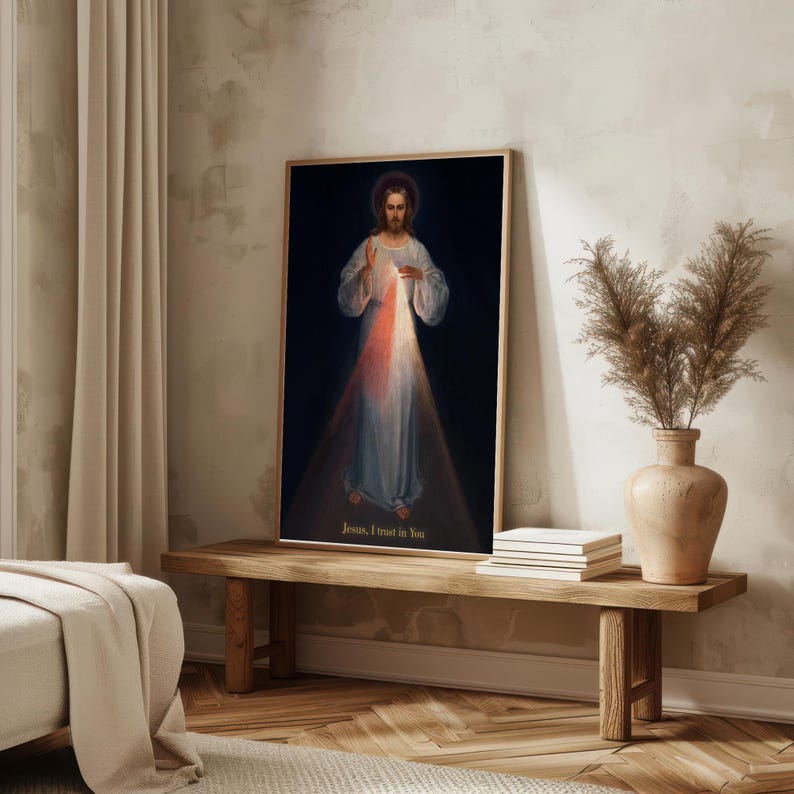 May include: A framed print of a religious figure with a halo, wearing a white robe, and with light emanating from the chest area. The text "Jesus, I trust in You" is at the bottom. The print is displayed on a wooden bench.