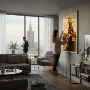 May include: A framed poster featuring a vintage-style illustration of a man on a motorcycle with the text "STATE" and "McQueen". The poster is displayed in a modern living room with a city view.