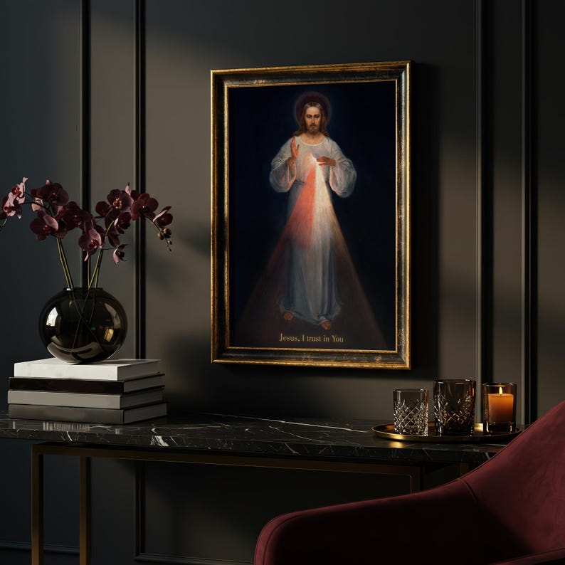 May include: Framed religious artwork depicting Jesus with a halo, radiating light. The painting features a dark background with the text "Jesus, I trust in You" at the bottom. The frame is gold-colored.
