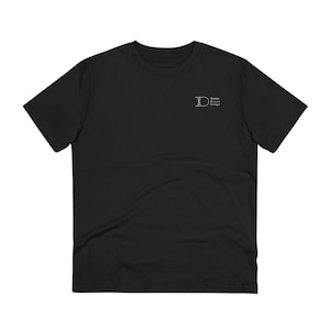 May include: Black short-sleeved t-shirt with a white embroidered logo that says "Dream Bridge Design".