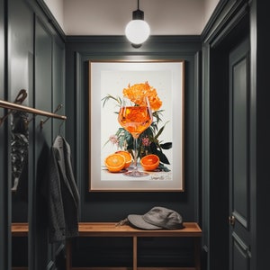 May include: A framed print of a glass of orange juice with orange slices and a flower arrangement. The print is titled "Sparkle Day".
