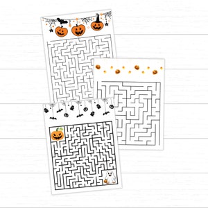May include: Three Halloween-themed maze puzzles on white paper. Each maze features a different design at the top, including pumpkins, bats, and ghosts. The mazes are printed in black ink.