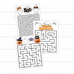 May include: Three Halloween-themed maze puzzles on white paper. The top puzzle has ghosts and the word "BOO". The middle puzzle says "Happy Halloween". The bottom puzzle has a pumpkin, ghost, spider, and cat.