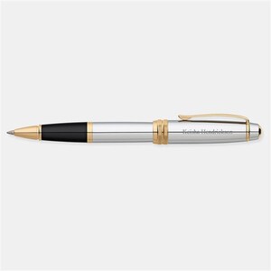 May include: A silver and gold pen with a black ink cartridge. The pen is engraved with the name "Keisha Hendrickson".