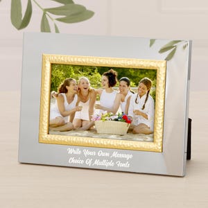 May include: A silver picture frame with a gold textured border. The frame holds a photo of five people. The text "Write Your Own Message Choice Of Multiple Fonts" is printed at the bottom of the frame.
