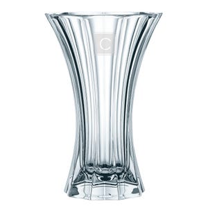 May include: A clear glass vase with a fluted design and a square base. The vase has a letter "C" etched on the front.