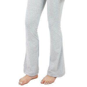 May include: Gray high-waisted flared pants with a wide waistband.