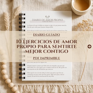 May include: A spiral-bound notebook with the title "DIARIO DE AMOR PROPIO" in Spanish. The notebook features text in Spanish, including "10 EJERCICIOS DE AMOR PROPIO PARA SENTIRTE MEJOR CONTIGO" and "PDF IMPRIMIBLE". The background is a neutral beige.