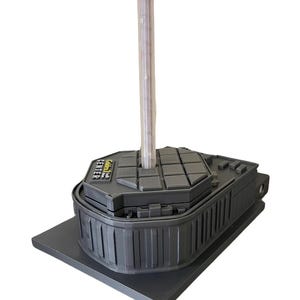 May include: A black plastic base with a round, textured top. The base has a label that reads "Golden Leaf Center". A clear plastic tube is inserted into the top of the base.