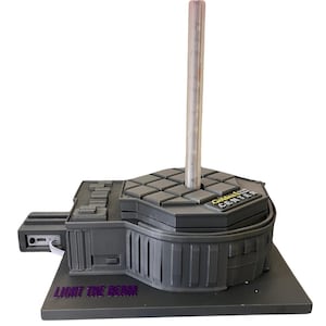 May include: A gray 3D printed model of a Star Wars lightsaber stand. The stand features a clear plastic lightsaber holder, a gray base with the text "Light the Beam" and a gray top with the text "Golden Tee Center".