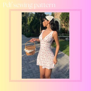 May include: White mini dress with a V-neck and red cherry print. The dress is sleeveless and has a fitted bodice. The image also shows a woven basket with a handle and a white scarf. The text "Pdf sewing pattern" is at the top.