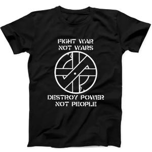 May include: A black short-sleeved t-shirt featuring a white graphic print. The design includes a circular cross symbol in the centre with the text FIGHT WAR NOT WARS above it and the text DESTROY POWER NOT PEOPLE printed below the symbol.