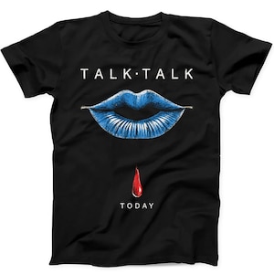 May include: A black short-sleeved t-shirt featuring the white text TALK TALK above a graphic of blue lips. Below the lips is a single red droplet graphic, followed by the white text TODAY centred at the bottom of the shirt design.