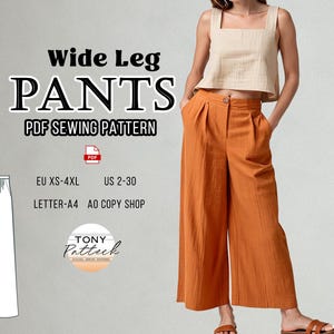 Op de afbeelding: Een PDF-naaipatroon voor een wijde broek. Het patroon omvat de maten XS-4XL (Nederlandse maten 34-52) en wordt afgedrukt op A4 of A0 formaat papier. Het patroon is te zien op een model dat een oranje wijde broek draagt.