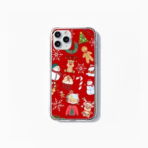 May include: A clear phone case with a red background and a Christmas-themed design. The design features various Christmas icons, including a snowman, a gingerbread man, a reindeer, a Christmas tree, and candy canes.